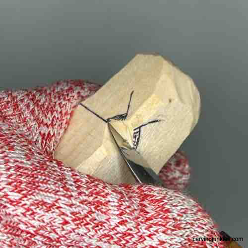 Master the art of making a wooden owl with our tutorial. Making an undercut on owl carving