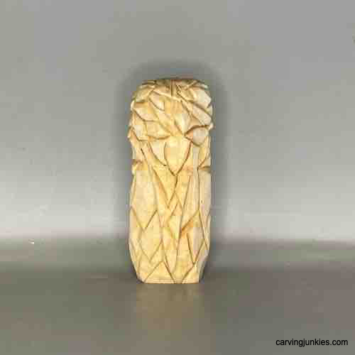 Experience the satisfaction of carving a wooden owl figure. Back view of unpainted owl carving