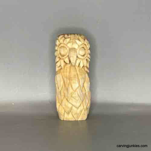 Craft an impressive owl from wood with our tutorial. Front of  raw owl wood carving