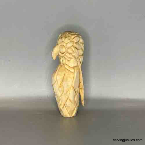Start carving a wooden owl with our beginner-friendly guide. Left view of unpainted owl carving