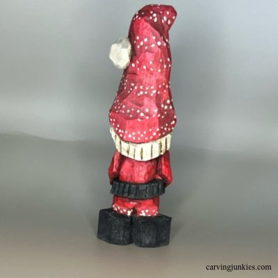 Front of painted wood carved Christmas gnome