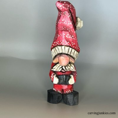 Front of painted wood carved Christmas gnome