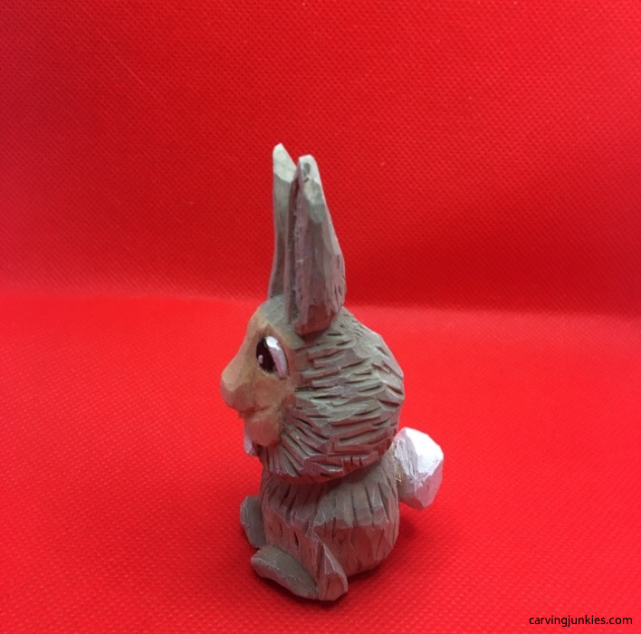 Paint added to left side of wood carving