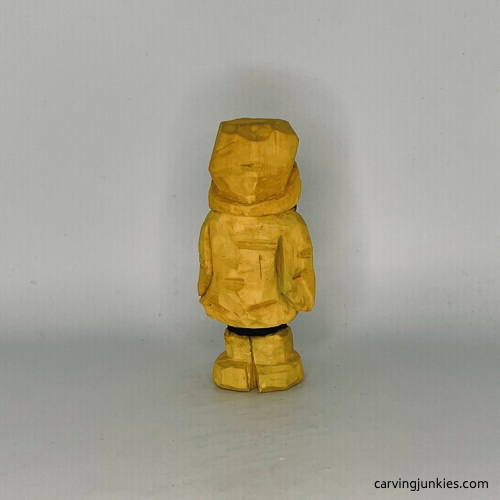 Back view of painted wood carved penguin