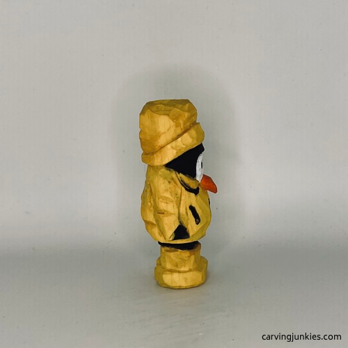 Right view of painted wood carved penguin