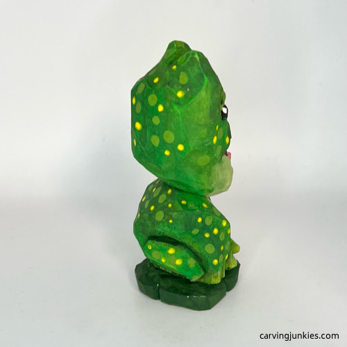 Right view of painted wooden frog carving