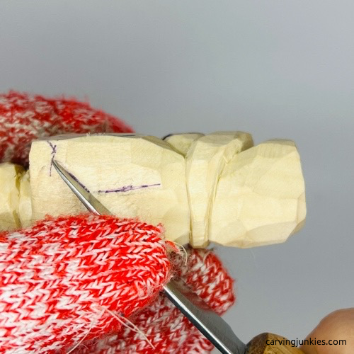 Making stop cut for carving a penguin