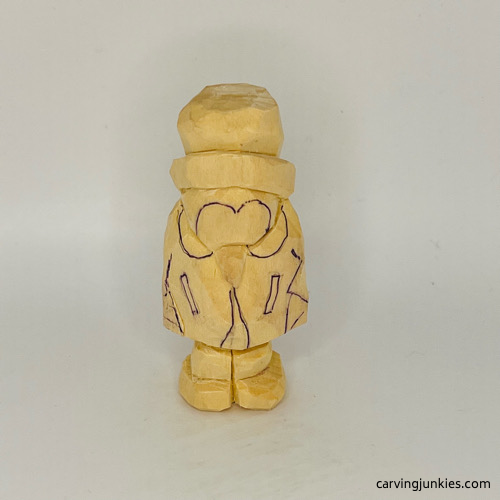 Clothing details on caricature wood penguin