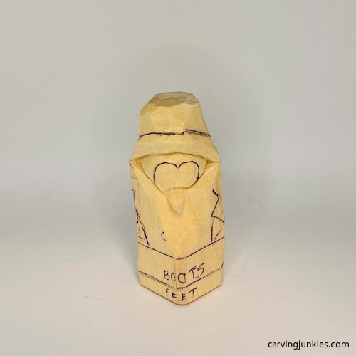 Finished beak on carved penguin