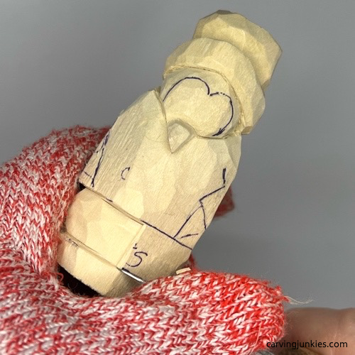 Separating bottom of carved penguin