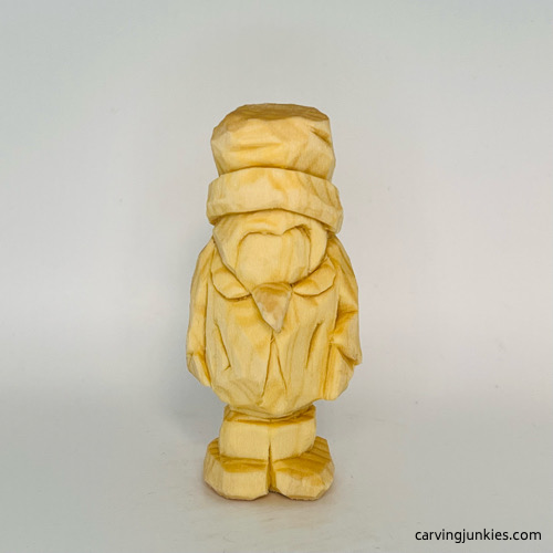 Unpainted carved wood penguin