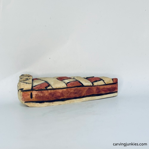 Right view of painted wooden pie carving