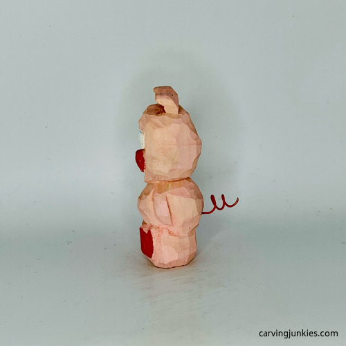 Left view of painted wood pig