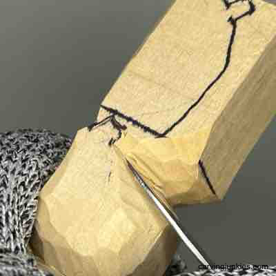 Shaping third pumpkin on wood carving