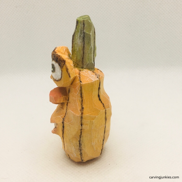 Left view of painted wood pumpkin