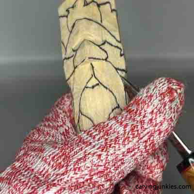 Making pyramid cut on green man