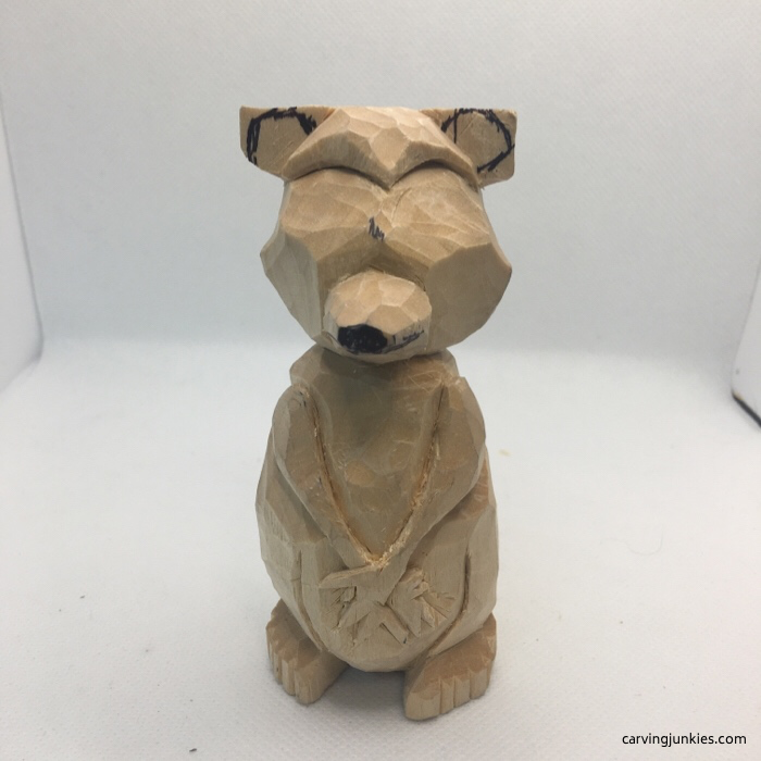 Carving face of raccoon