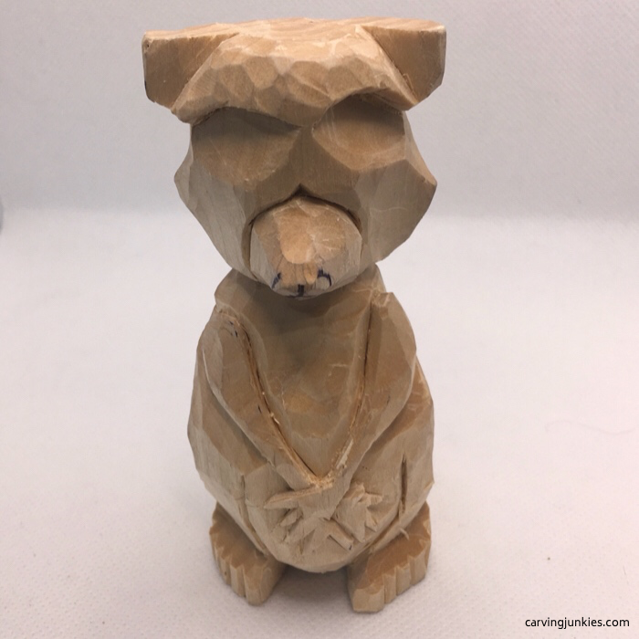 Carving wooden raccoon