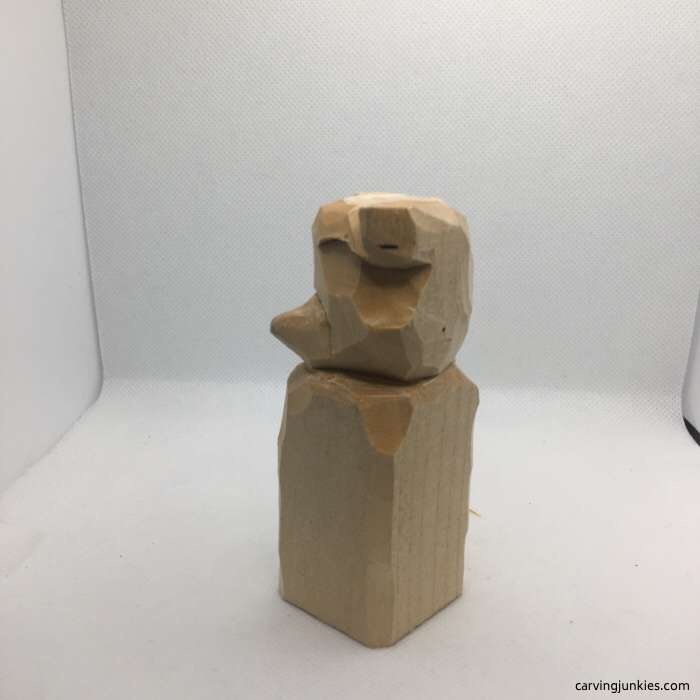 Left view of raccoon carving