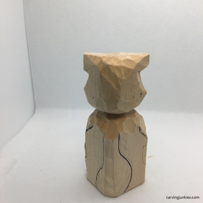 Back of wood raccoon carving