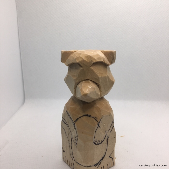 Rounded body of carved raccoon