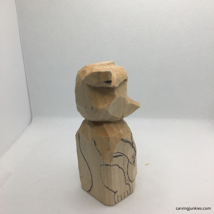 Carved raccoon body from right