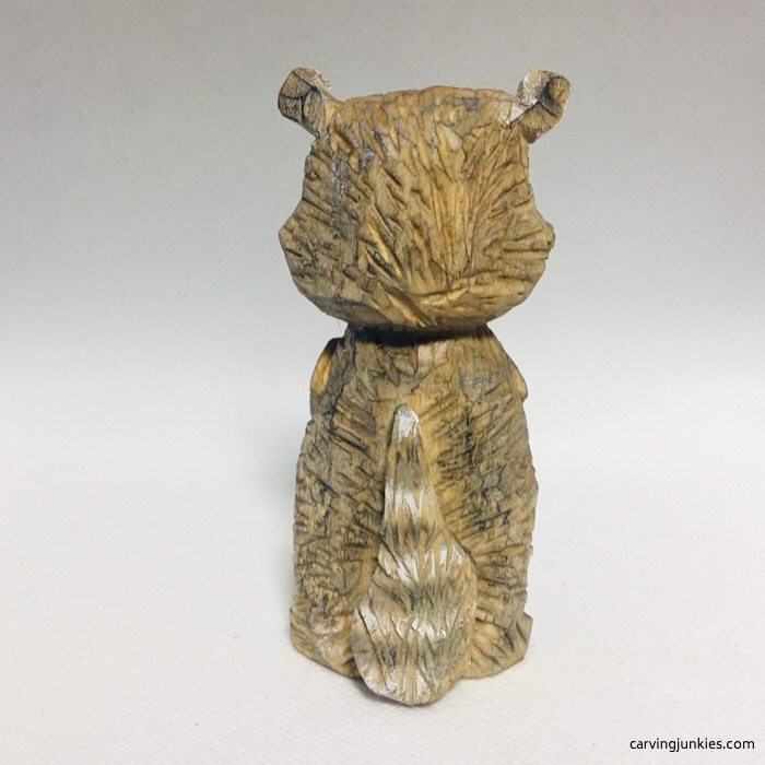 Colorful tail of finished raccoon carving