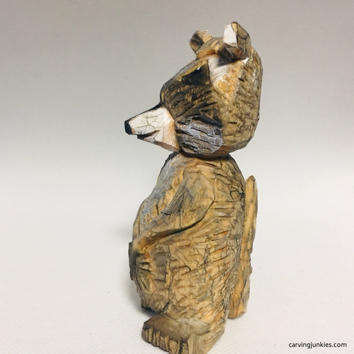Finished left side view of raccoon carving