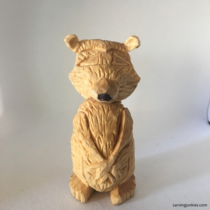 Washed wood carving of raccoon