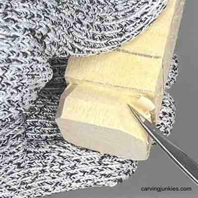 Rounding the corners on wood carved scarecrow