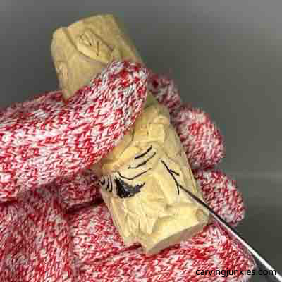 Carving leaf stems on green man