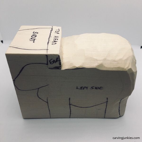 Rounded top of sheep carving (left view)