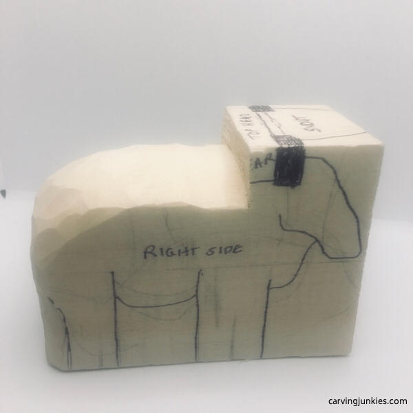 Rounded top of sheep carving (right view)