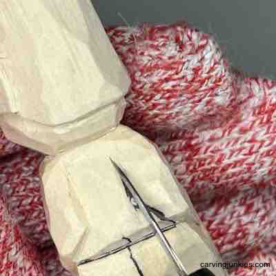 Learn to bring a little wooden figure to life with our guide. Carving back of arms on small guy wood carving