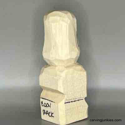 Follow our instructions to carve a small wooden figure. Rounded head on back of small guy wood carving