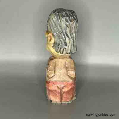 Join us and learn to create a miniature wooden person today! Painted back of small guy wood carving