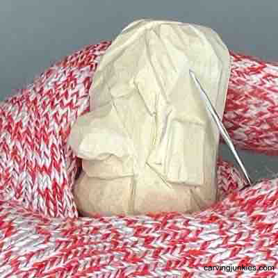 Learn to create a miniature wooden figure with our tutorial. Carving hair on small guy wood carving