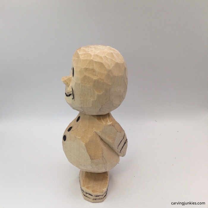 Left view of wood carved snowman