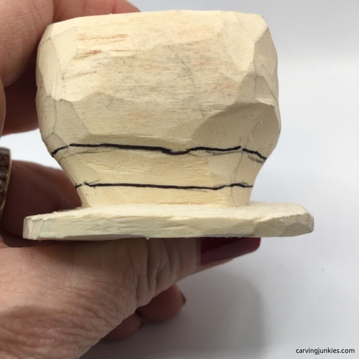 Brim drawn on wood carved snowman hat