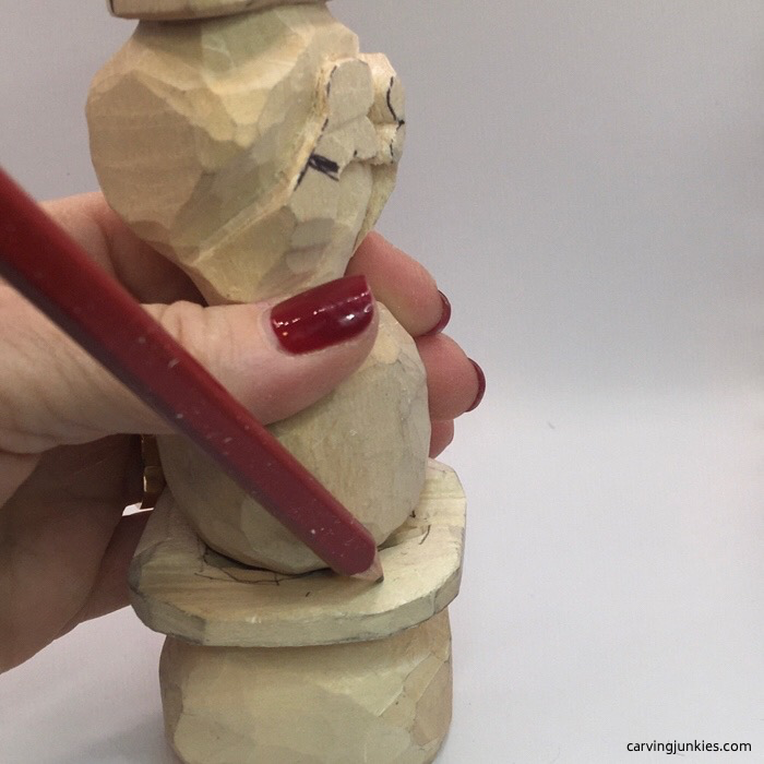Tracing wood carved snowman head