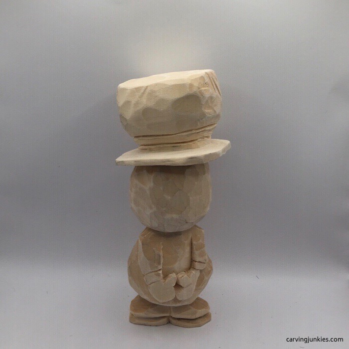 Back view of wood carved snowman