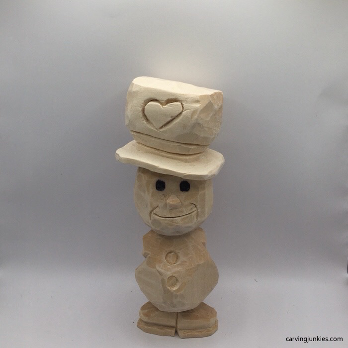 Wood carved snowman before painting
