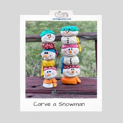 Adorable stacked snowman wood carving with colorful scarves and polka dot hats