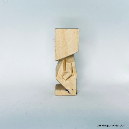 Arm is carved on tiny wood carving man