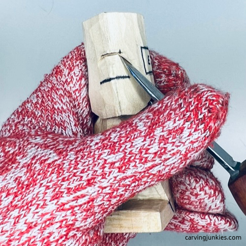 Carving eyeline on tiny wood carving man