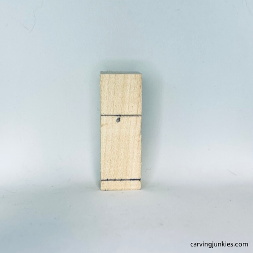 Back guidelines on tiny wood carving man