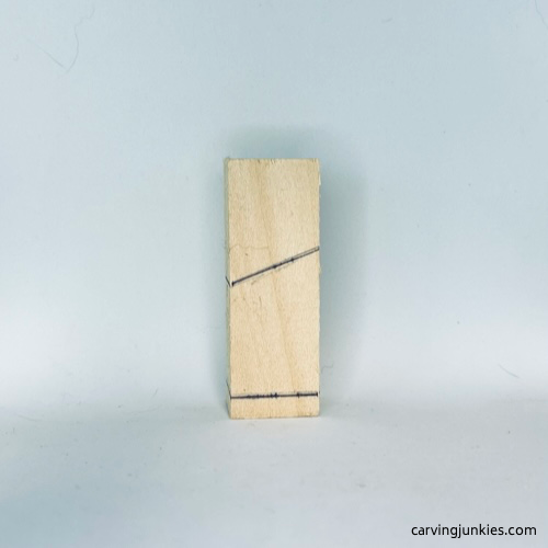 Left guidelines on tiny wood carving man