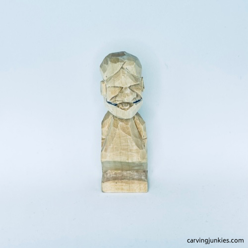 Adding mustache to tiny wood carving man
