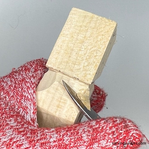 Carving back upper arms on tiny wood carving man