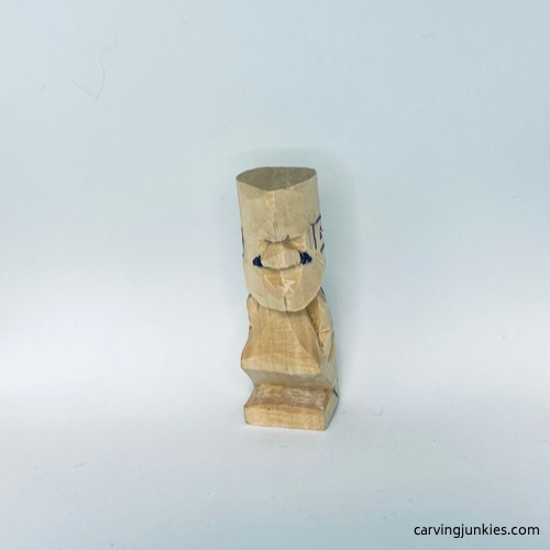 Adding wings on tiny wood carving man nose